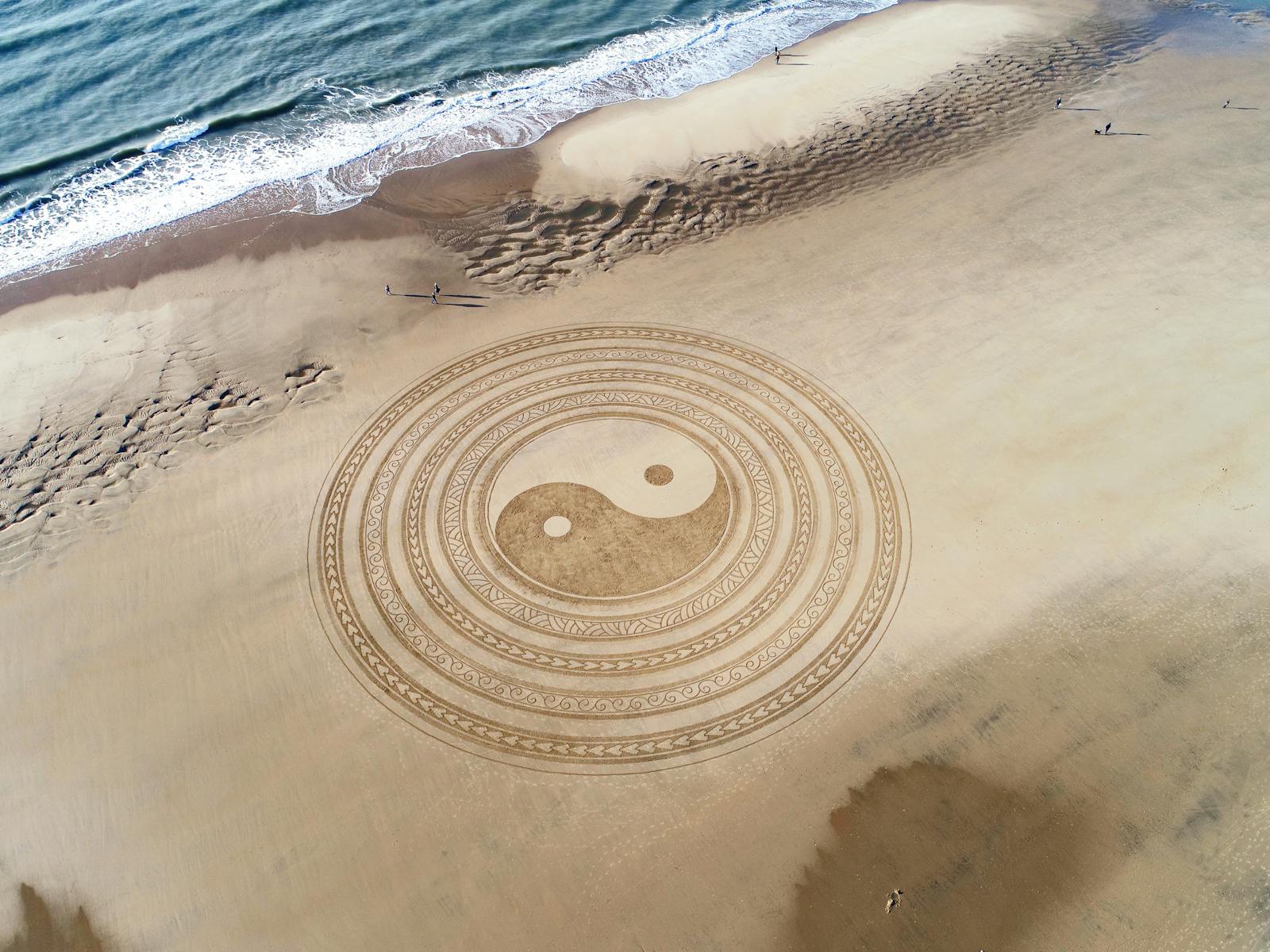 Photo by Jben Beach Art Aerial view of intricate Yin Yang design on La Tremblade beach sand
